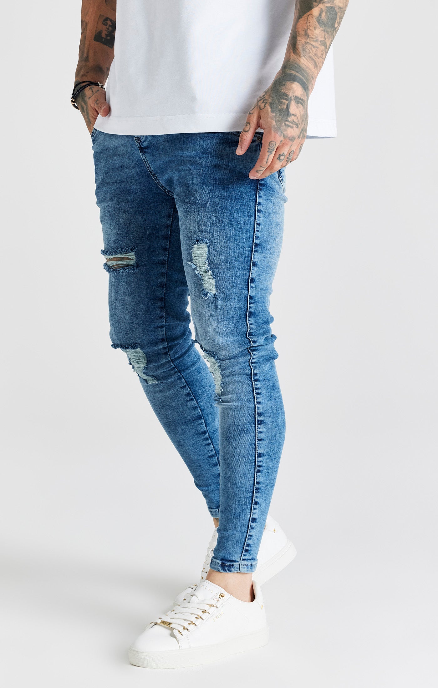 Load image into Gallery viewer, Blue Mid Wash Distressed Skinny Jean