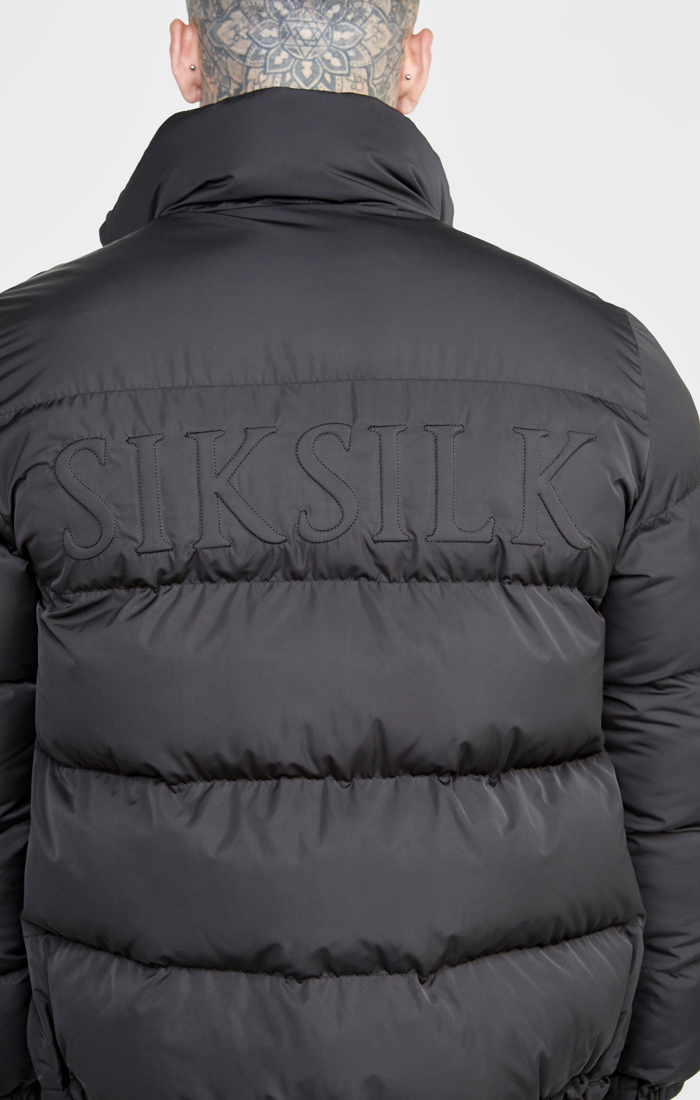 Load image into Gallery viewer, Black Embossed Logo Bubble Jacket (1)